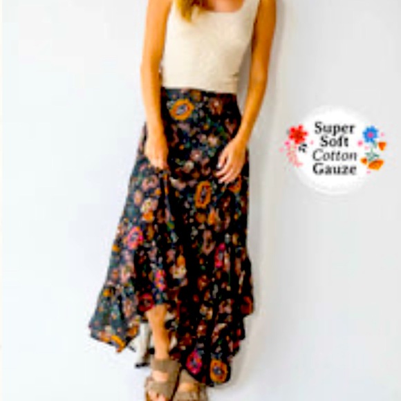 This is a beautiful brand new black floral skirt. It is a fall and winter flow. - Picture 1 of 7